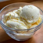 Bowl of creamy homemade carnivore vanilla ice cream in natural light.